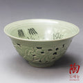 Openwork celadon tea bowl with lotus by Park Gyeong-seon