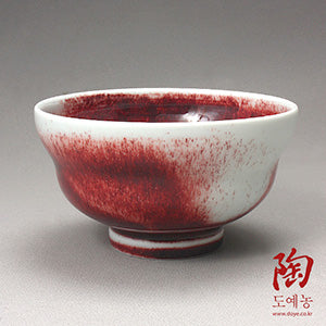Copper-red jinsa tea bowl by Yi Young-sik